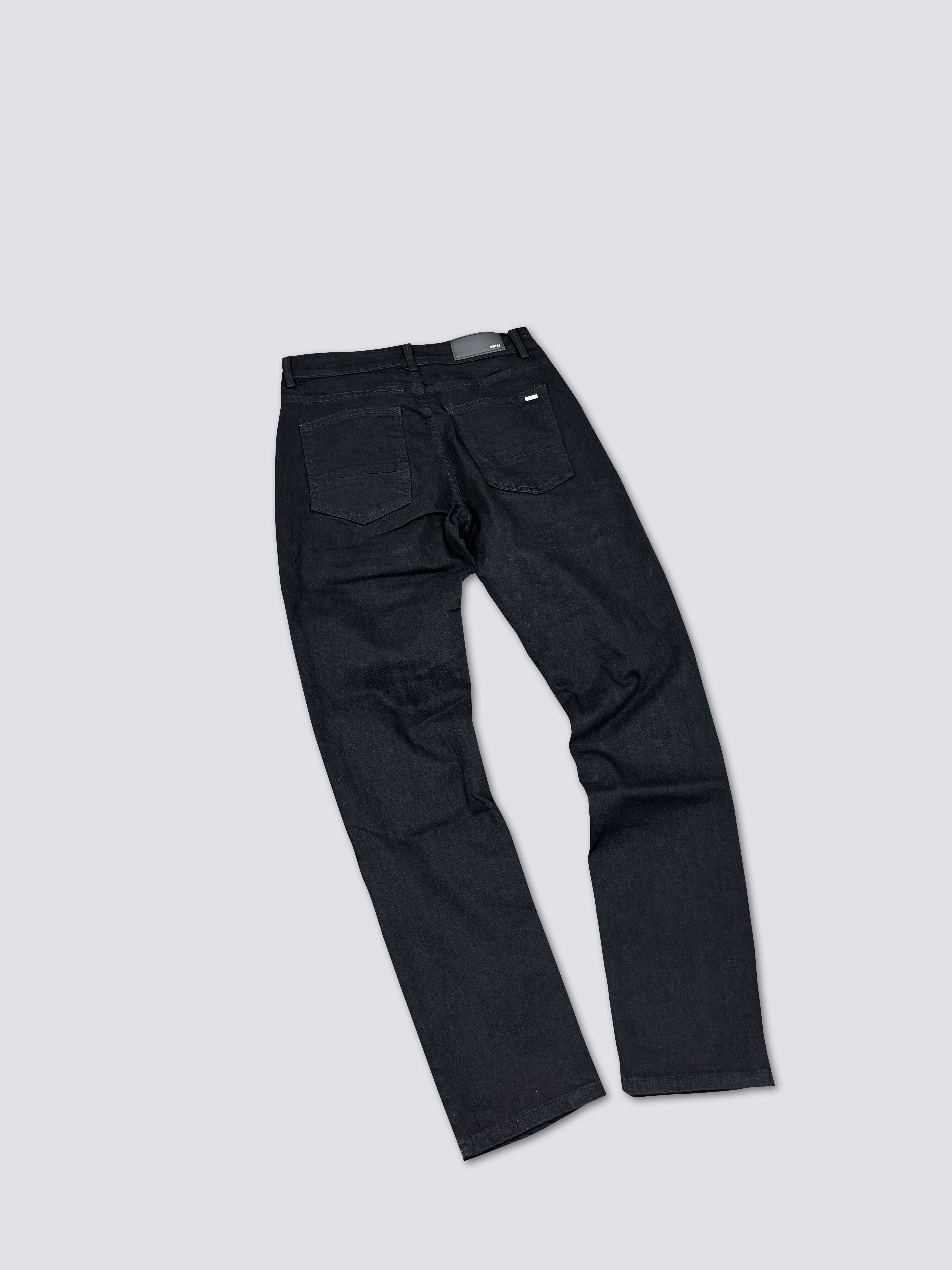 AMIRI washed denim with ink splatter and distressed details and silver rhinestone embellishments A011