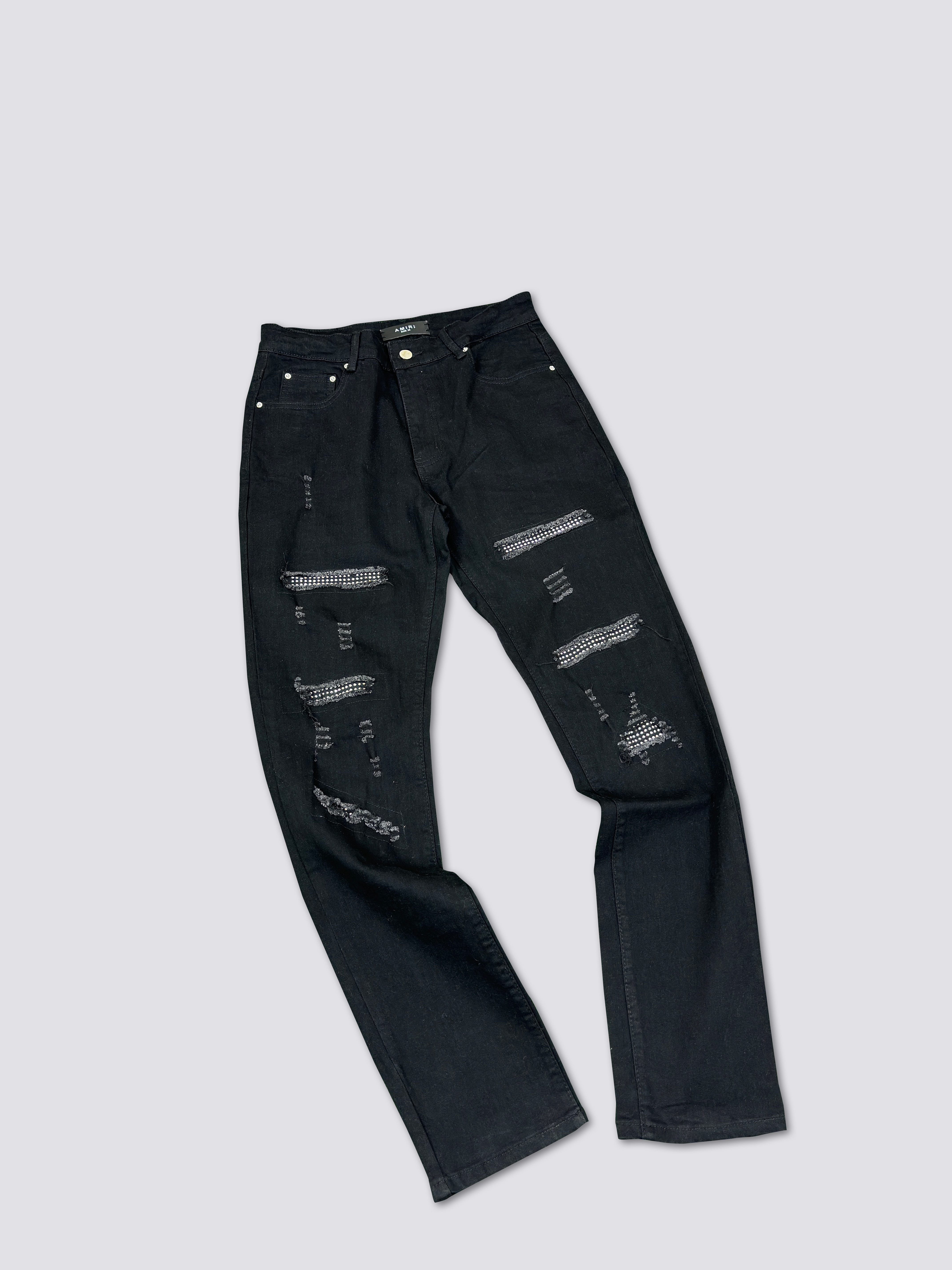 AMIRI washed denim with ink splatter and distressed details and silver rhinestone embellishments A011