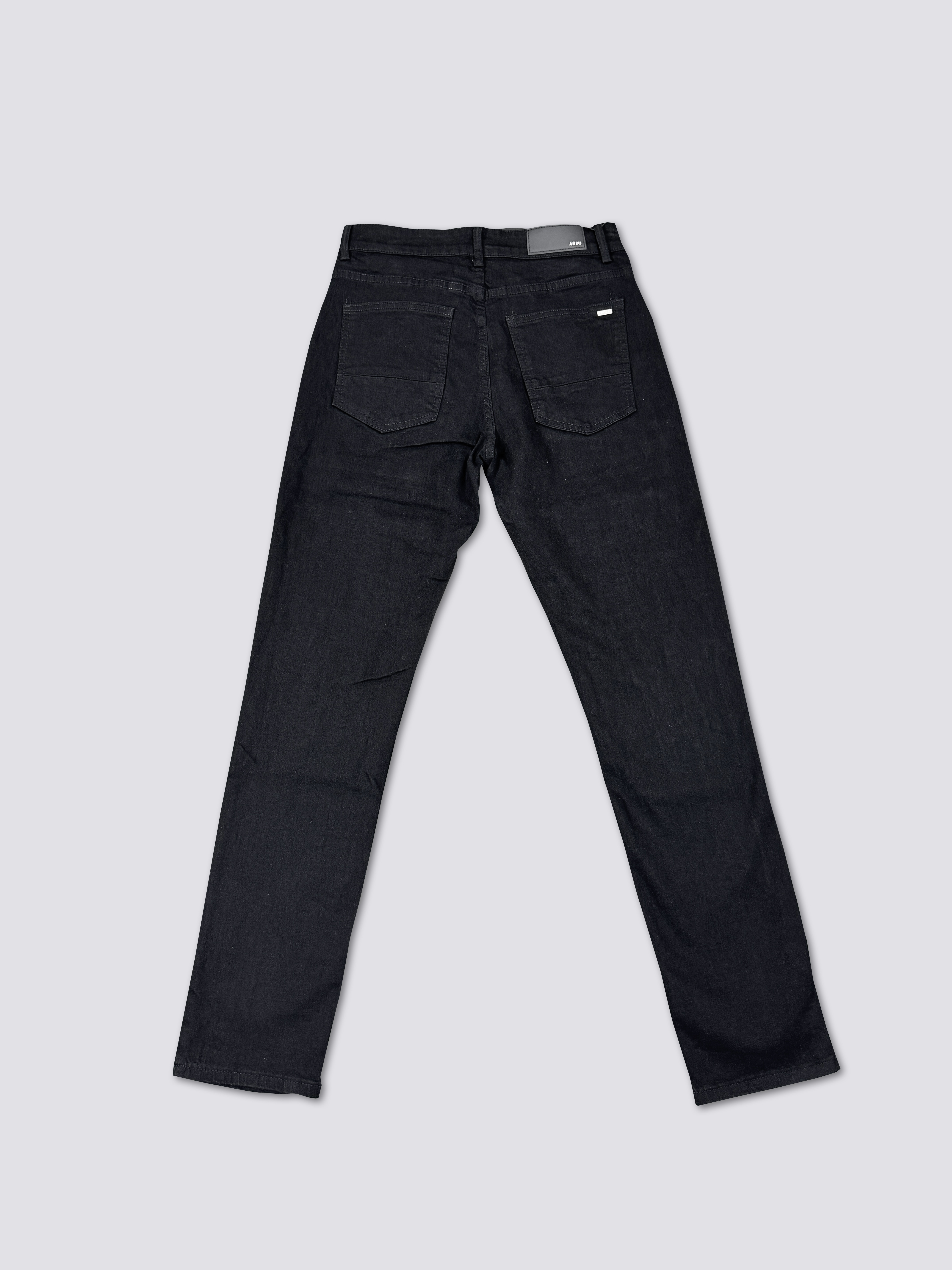 AMIRI washed denim with ink splatter and distressed details and silver rhinestone embellishments A011