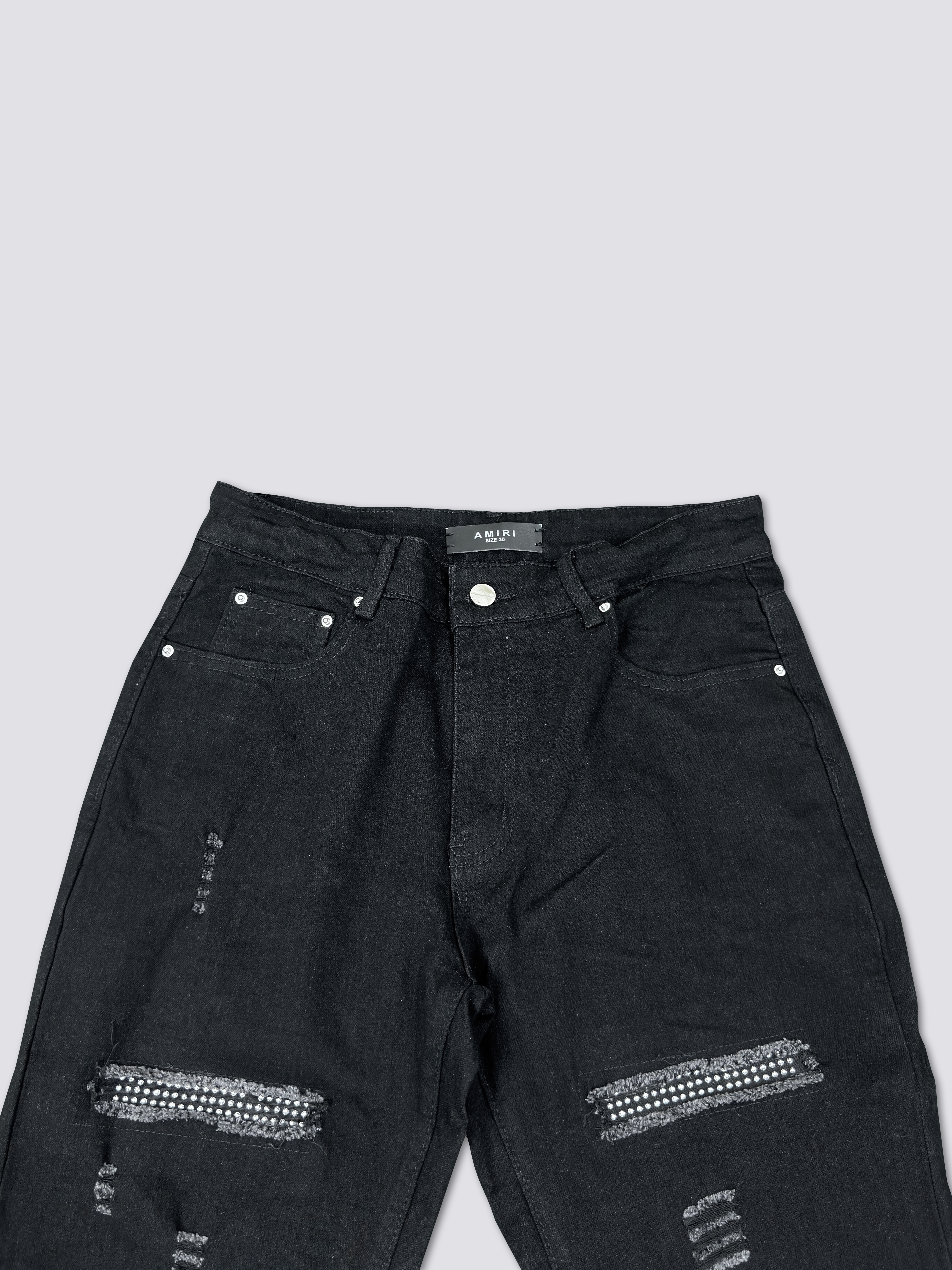 AMIRI washed denim with ink splatter and distressed details and silver rhinestone embellishments A011