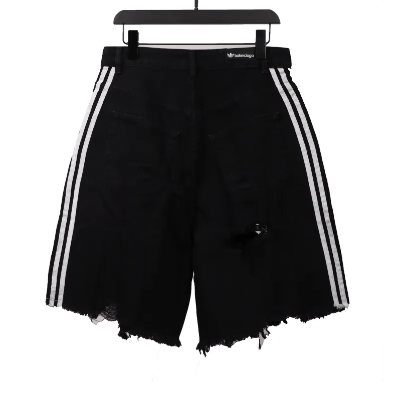 Balenciaga co-branded washed and ripped denim shorts Jeans