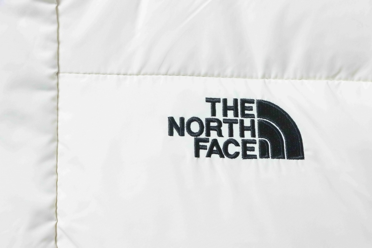 The North Face Long warm hooded down jacket White/Black