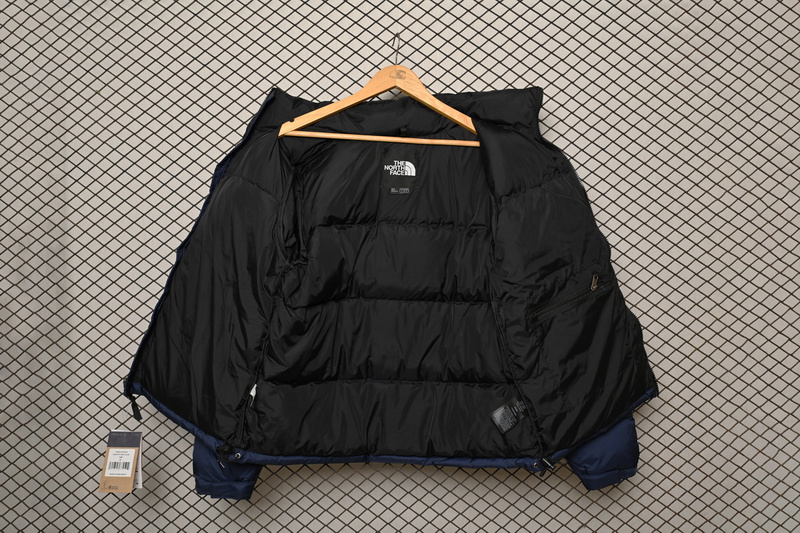 the n0*h F**e splicing white and navy down jacket
