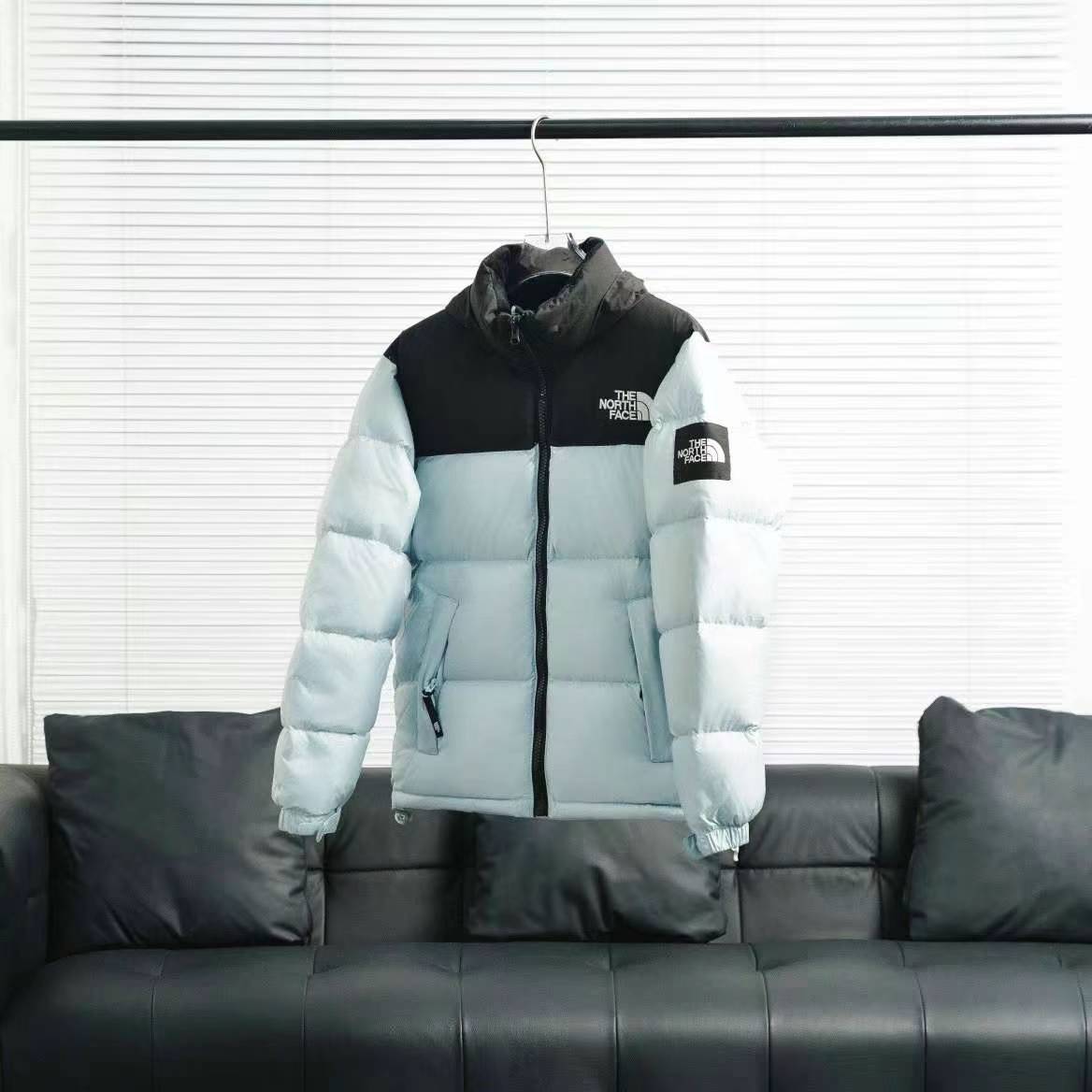 the n0*h F**e splicing white and blue down jacket