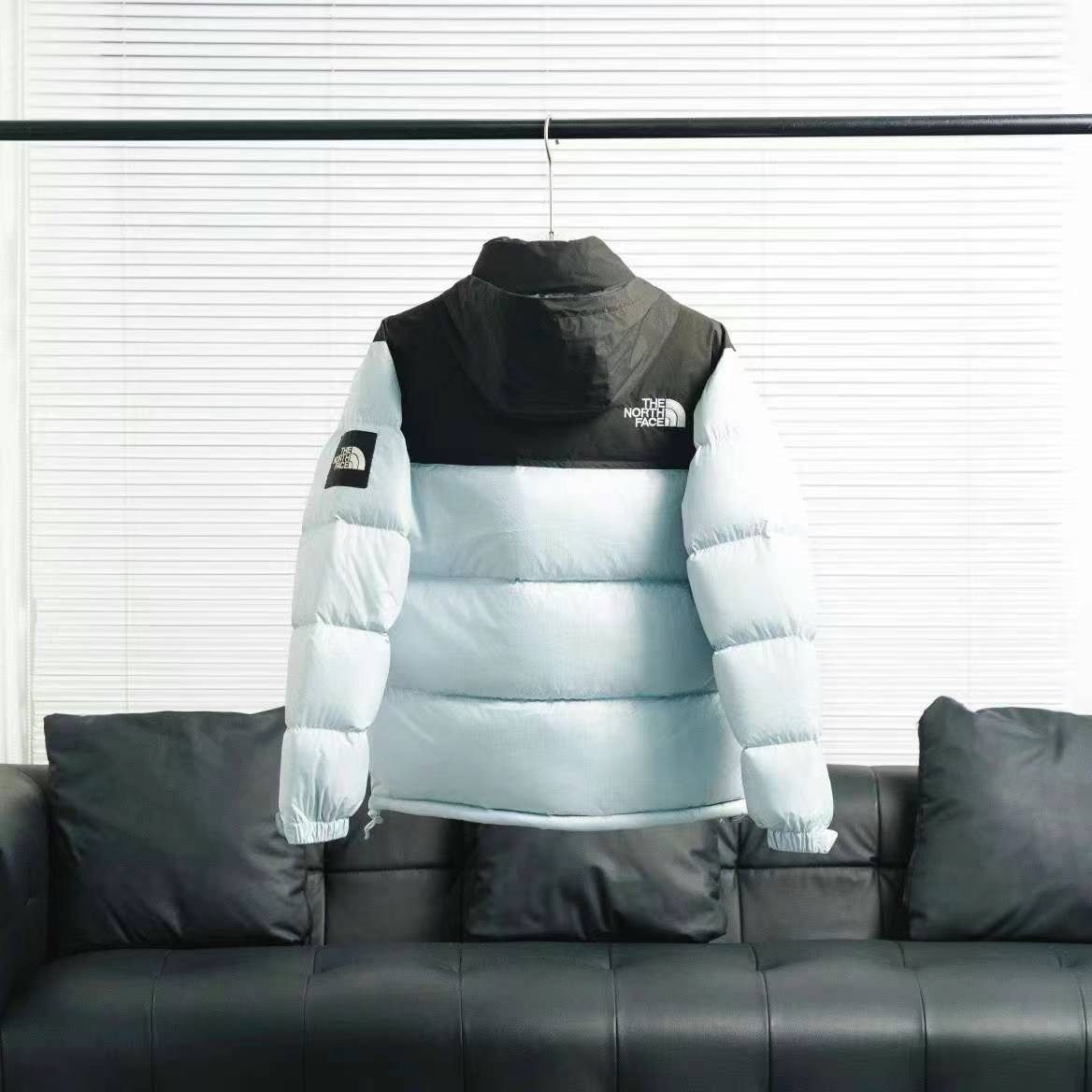 the n0*h F**e splicing white and blue down jacket