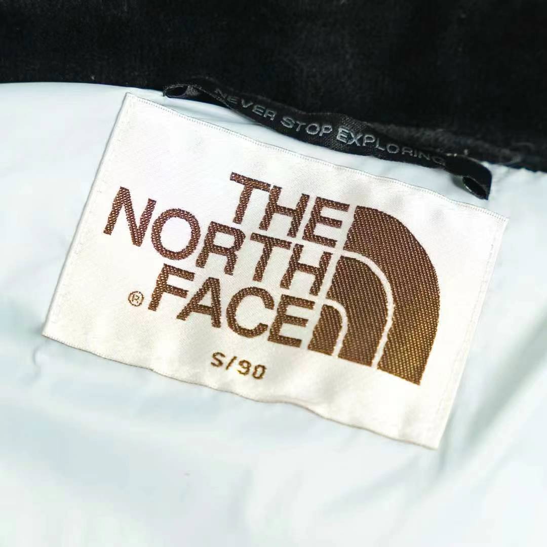 the n0*h F**e splicing white and blue down jacket