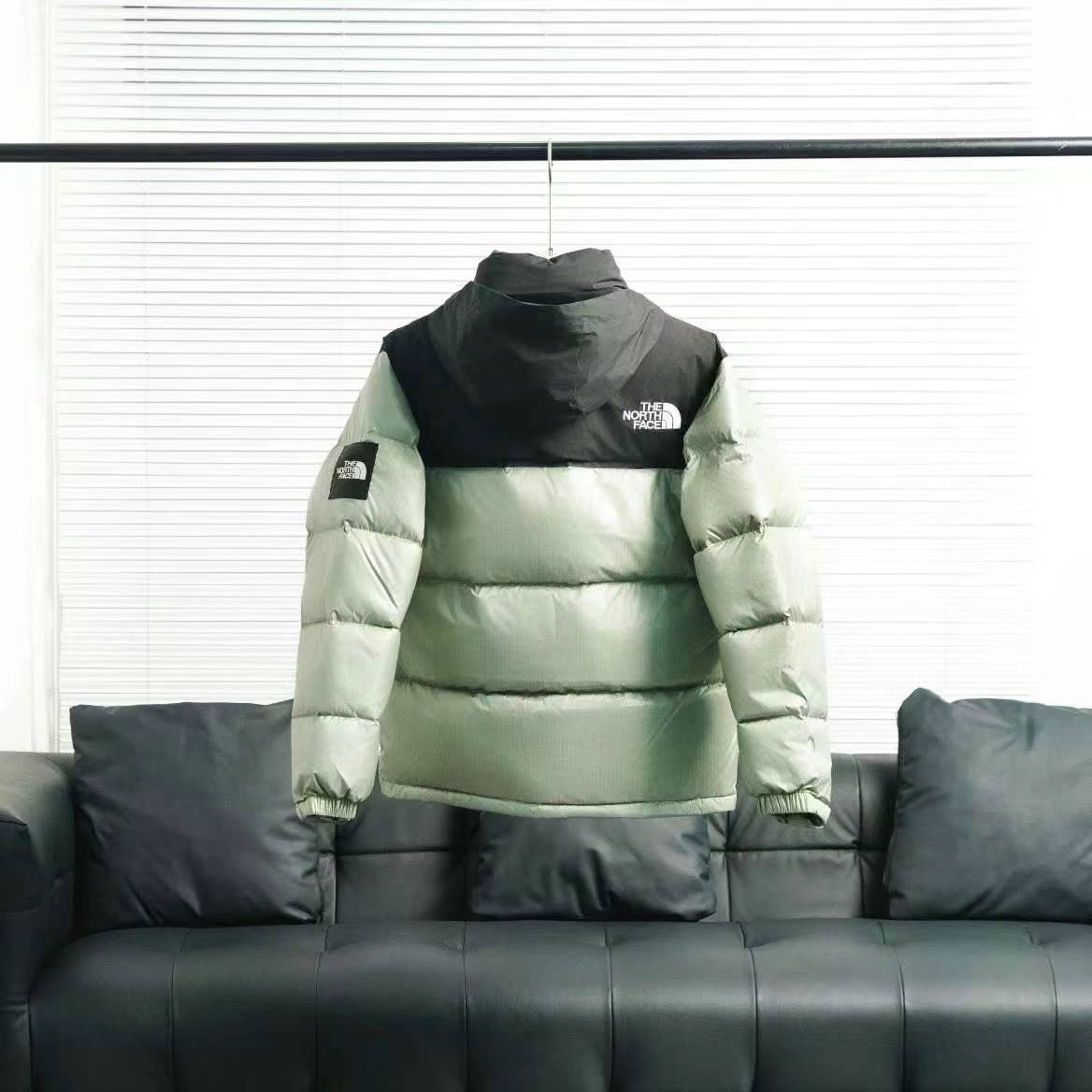 the n0*h F**e splicing white and green down jacket