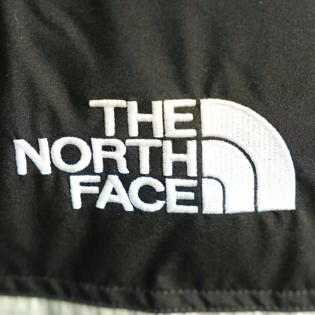 the n0*h F**e splicing white and green down jacket