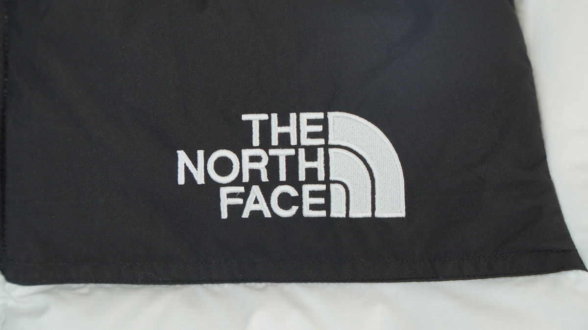 the n0*h F**e splicing white and white down jacket