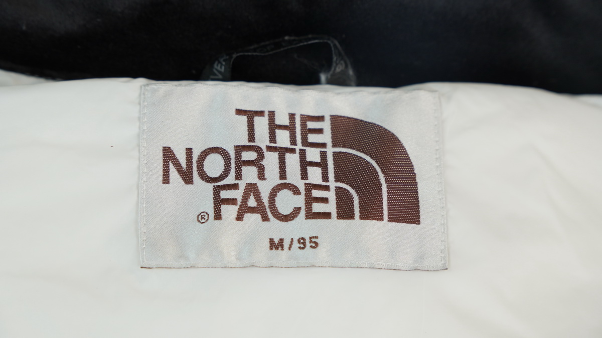 the n0*h F**e splicing white and white down jacket