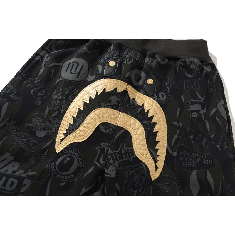 bape x nbhd joint style shark head black and gold trousers