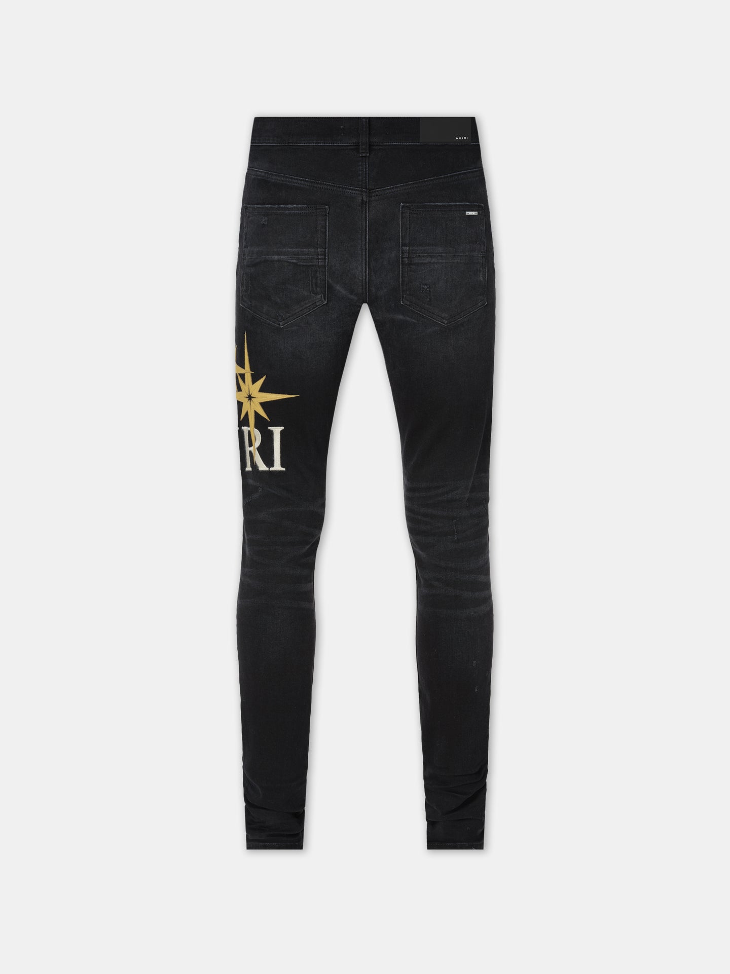 AMIRI STARBURST APPLIQUE SKINNY JEAN