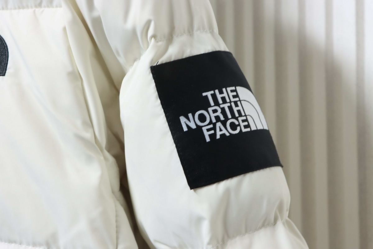 The North Face long hooded down jacket in white