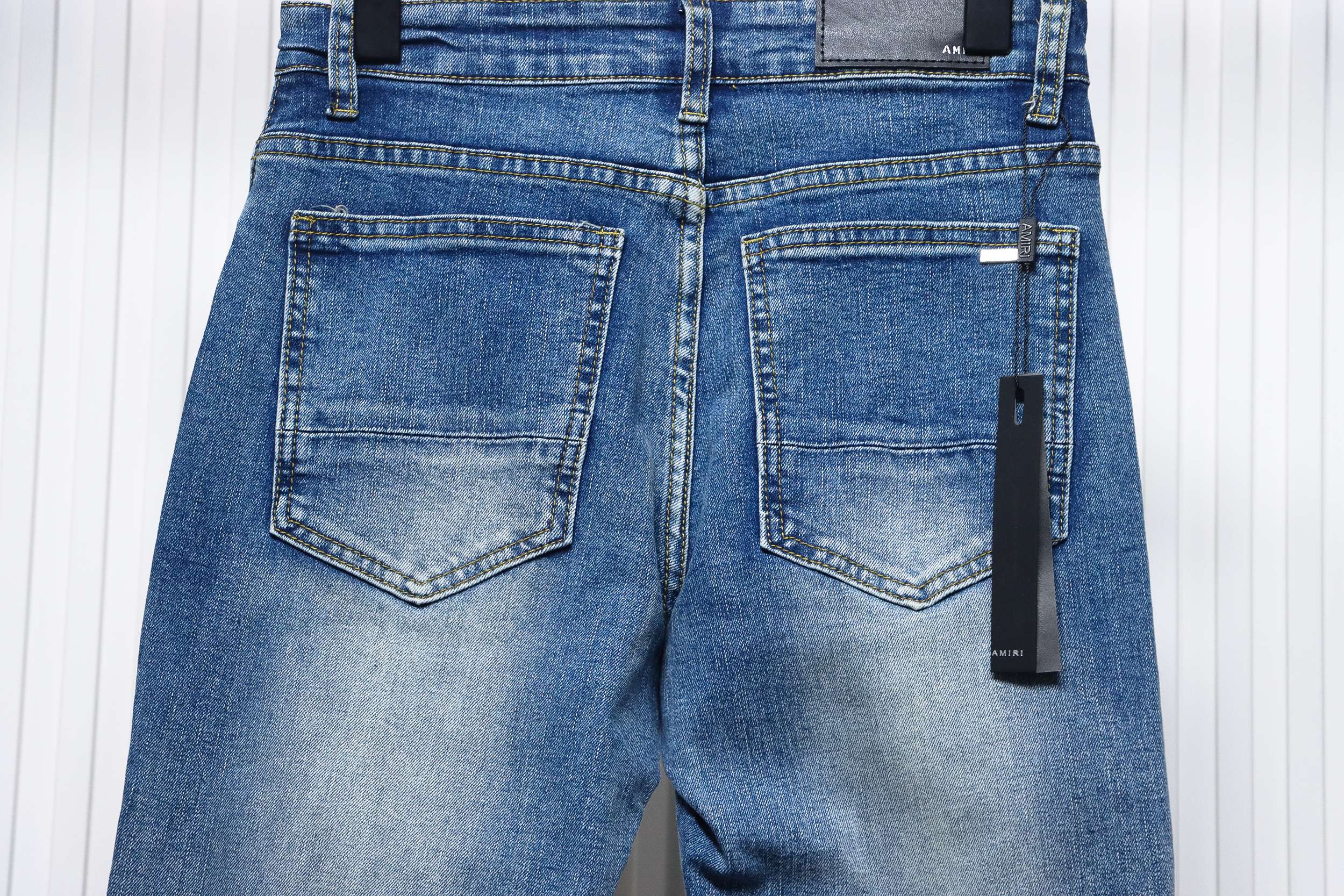 AMIRI MX1 pink diamond washed ripped denim trousers