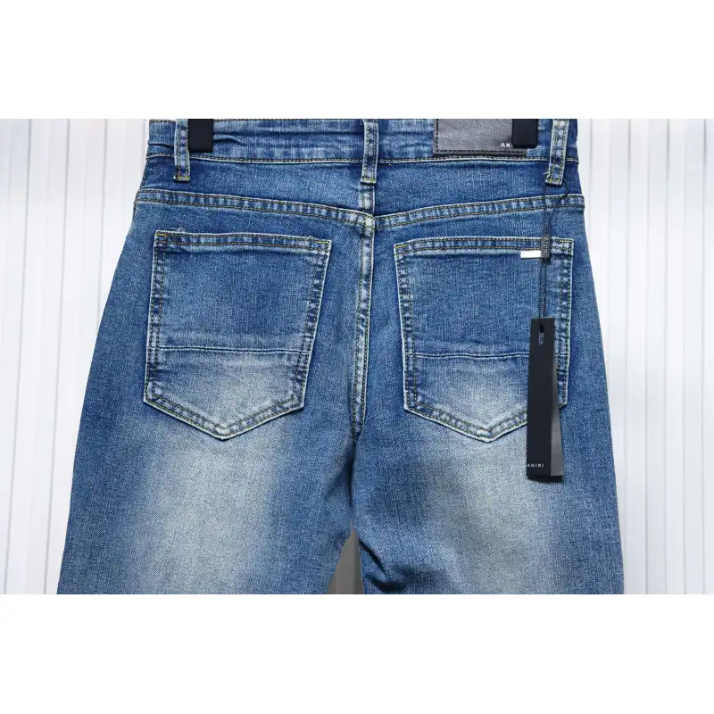 AMIRI MX1 pink diamond washed ripped denim trousers