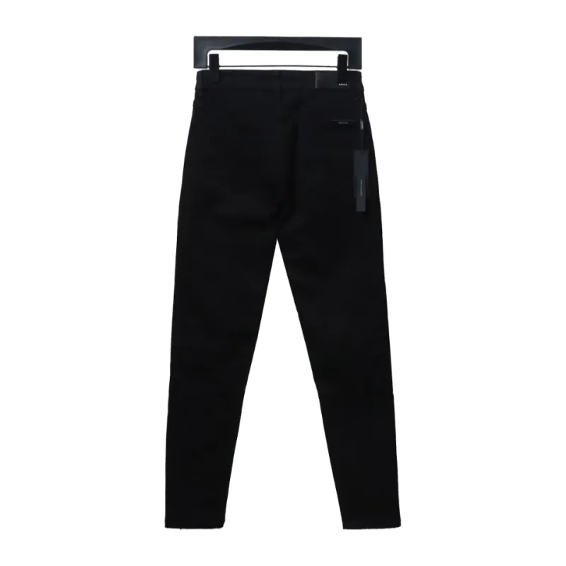 AMIRI MX1 zip-up washed stretch denim trousers