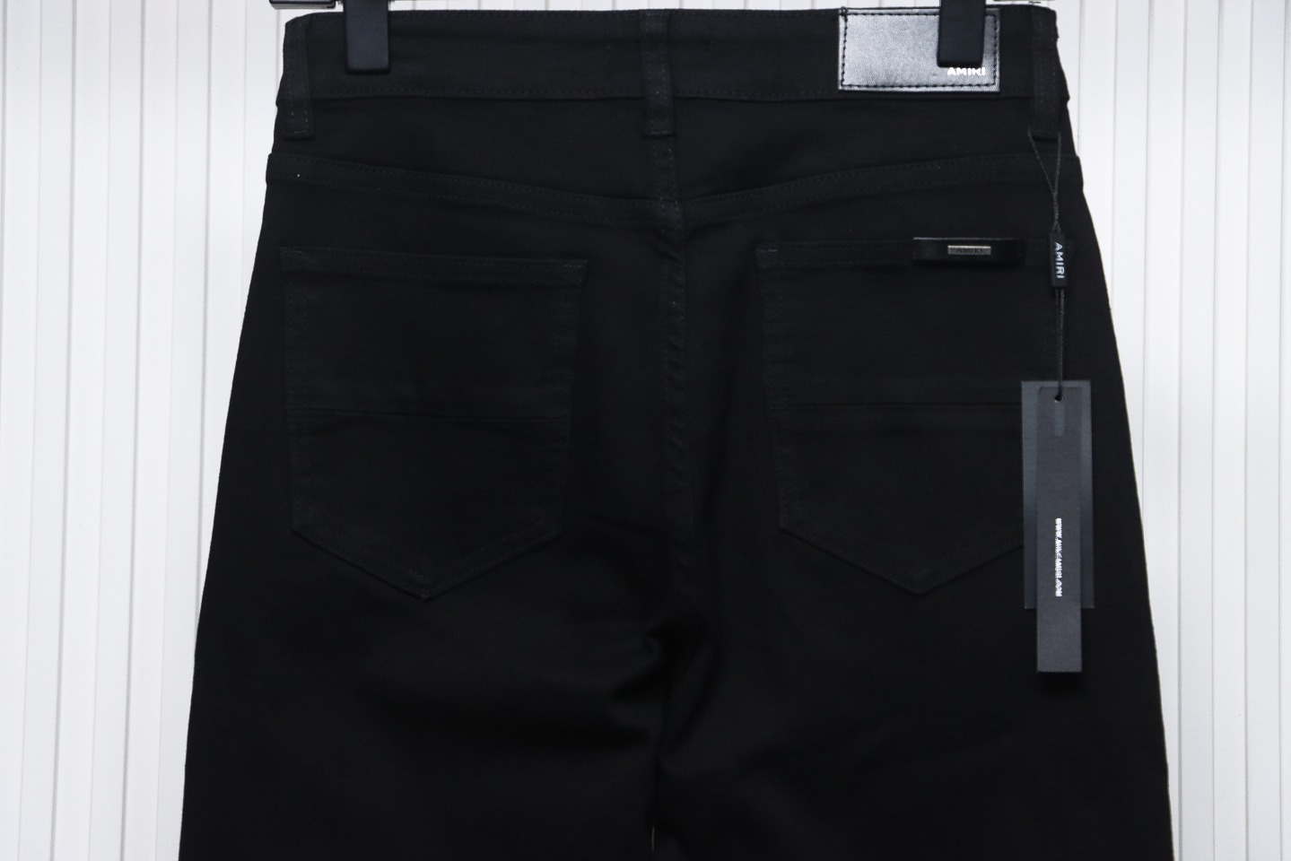 AMIRI MX1 zip-up washed stretch denim trousers