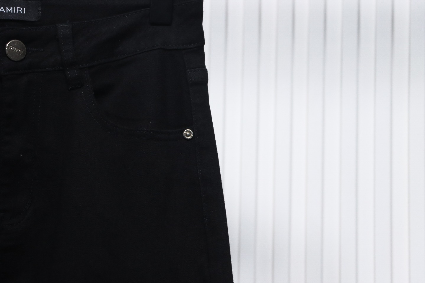 AMIRI MX1 zip-up washed stretch denim trousers