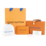 LV monogram small backpack with pendant and leather bracelet