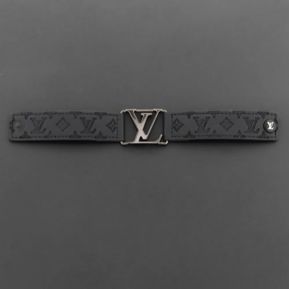 LV engraved metal leather bracelet