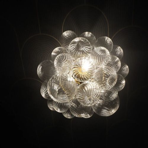 Clear glass bubble chandelier design to maximize visual impact with transparent elements